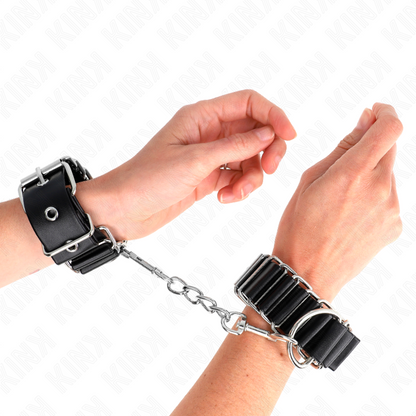 KINK - APPUI-POIGNETS FINS COMME CHARNIÈRES NOIR RÉGLABLE 16-22 CM X 3,5 CM KINK WRIST RESTRAINT